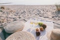 Romantic picnic for couple on the beach at sunset