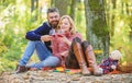 Romantic picnic with wine in forest. Couple in love celebrate anniversary picnic date. Couple cuddling drinking wine Royalty Free Stock Photo