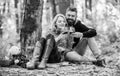 Romantic picnic with wine in forest. Couple in love celebrate anniversary picnic date. Couple cuddling drinking wine Royalty Free Stock Photo