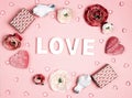 Romantic pink background with word love, gifts, flowers and decorative hearts Royalty Free Stock Photo