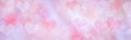 Romantic pink and lilac bokeh background with hearts. Pastel valentine backdrop