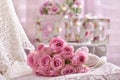 Romantic pink rose bouquet lying on the bed