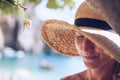 Romantic portrait of a beautiful blond woman in a straw hat on the beach in Corfu Royalty Free Stock Photo