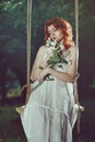 Romantic portrait of a beautiful woman with red hair