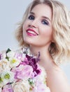 Romantic portrait of beautiful young woman with flowers over whi Royalty Free Stock Photo