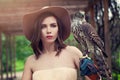 Romantic portrait of elegant woman with bird outdoors, fashion portrait Royalty Free Stock Photo