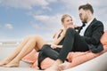 Romantic portrait of young caucasian couple toasting champagne on on luxury yacht in the sea. People celebrating wedding Royalty Free Stock Photo