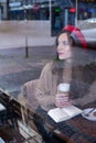 Romantic pretty woman outside cafe window Royalty Free Stock Photo