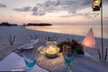 Romantic, private dinner setup at a tropical beach Royalty Free Stock Photo