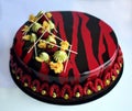 Romantic red and black raspberry cake with pistachio ganache and fresh berries