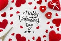 Romantic red flat lay composition on white background. Heart top view. Happy Valentines day hand lettering greeting card Royalty Free Stock Photo