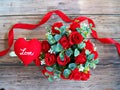 Romantic red heart with love and ribbon and roses on wood floor Royalty Free Stock Photo