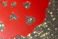 Romantic red hearts on a golden mesh