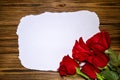 Romantic red roses flowers on a vintage wooden planks background.