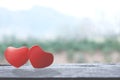 Romantic red two love hearts shape on wooden table. Valentine`s day greeting card. Hearts on a wooden table. Soulmate concept Royalty Free Stock Photo