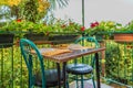 Romantic restaurant table and geraniums