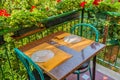 Romantic restaurant table and geraniums