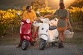 Romantic road trip on scooter at sunset on vacation