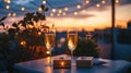 A romantic rooftop dinner with a ring box placed between two champagne Royalty Free Stock Photo