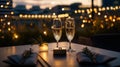 A romantic rooftop dinner with a ring box placed between two champagne Royalty Free Stock Photo