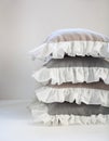 Romantic ruffled linen pillows stack isolated on white Royalty Free Stock Photo