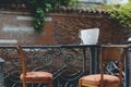 Romantic scenary, table with two chairs, two glasses of wine and a bottle of wine