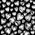 Romantic seamless pattern with cute images of hearts on a black background. Chalk drawing on a school blackboard.