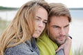 Romantic seaside couple relaxing in sand dune - autumn, beach Royalty Free Stock Photo