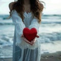 Romantic seaside scene Woman holds red heart, Valentines concept