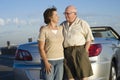 Romantic Senior Couple Standing In Front Of Car Royalty Free Stock Photo