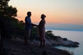 Romantic senior couple standing and holding hands near the sea Royalty Free Stock Photo