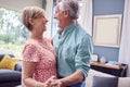 Romantic Senior Retired Couple Dancing In Lounge At Home Together Royalty Free Stock Photo
