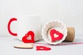 Romantic set for Valentine's Day concept. Wooden red hearts white cup decorations stuff for gifts light background. Royalty Free Stock Photo