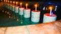Romantic Setting with Lit Candles on Pillars in Swimming Pool Royalty Free Stock Photo