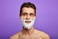 Romantic shirtless man with shaving foam