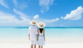 Romantic silhouette of an unrecognizable couple enjoying a bright summer day at the beach