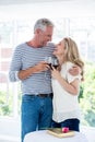 Romantic smiling mature couple with red wine Royalty Free Stock Photo