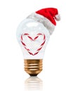 Romantic Snow Globe Light Bulb Candy Cane With Santa Hat And Copy Space Royalty Free Stock Photo