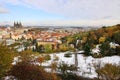 Romantic snowy colorful autumn Prague with gothic Castle and St. Nicholas' Cathedral, Czech Republic Royalty Free Stock Photo