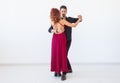 Romantic, social dance, people concept - couple dancing the salsa or kizomba or tango on white background with copy Royalty Free Stock Photo