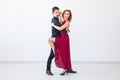 Romantic, social dance, people concept - couple dancing the salsa or kizomba or tango on white background with copy Royalty Free Stock Photo