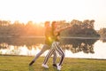 Romantic, social dance and people concept - young couple dancing bachata on the background of sunset Royalty Free Stock Photo