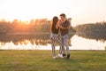 Romantic, social dance and people concept - young couple dancing bachata on the background of sunset Royalty Free Stock Photo