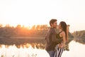 Romantic, social dance and people concept - young couple dancing bachata on the background of sunset Royalty Free Stock Photo