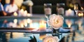 night Luxury resort poool glasses of wine and candles with tropic roses flowers spa relaxing background Royalty Free Stock Photo