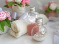 Cosmetic pearl bottles, towel, bouquet of soap flowers on white background. Royalty Free Stock Photo