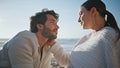 Romantic spouses looking each other with love sitting beach at evening close up. Royalty Free Stock Photo