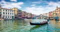 Romantic spring scene of famous Canal Grande. Colorful morning panorama with Rialto Bridge. Picturesque cityscape of Venice,