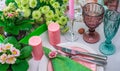 Romantic spring table setting for two with wine glasses, candles and flowers Royalty Free Stock Photo