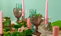 Romantic spring table setting for two with wine glasses, candles and flowers Royalty Free Stock Photo